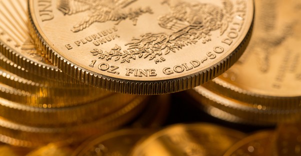 Stack of gold coins that are sold as etfs
