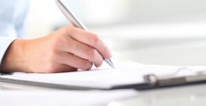 a health professional writes down bladder treatment options on a clipboard