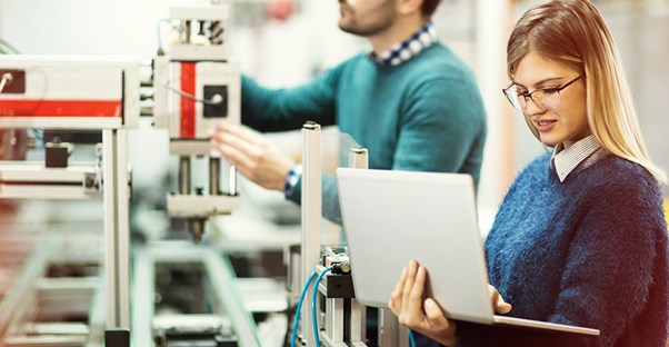 Mechanical engineers look over their work