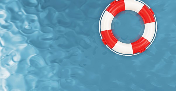 A lifeguards raft floats in the pool