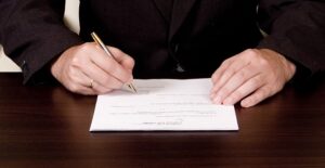 person signing over their beneficiary