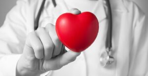 doctor with a heart demonstrating types of ejection fraction
