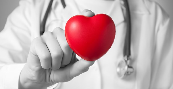 doctor with a heart demonstrating types of ejection fraction