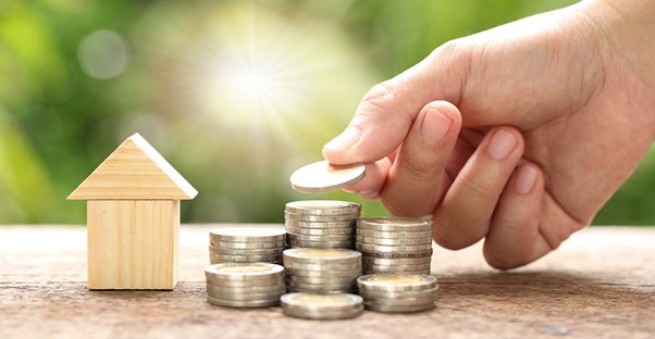 stack of coins and house to represent cost of living
