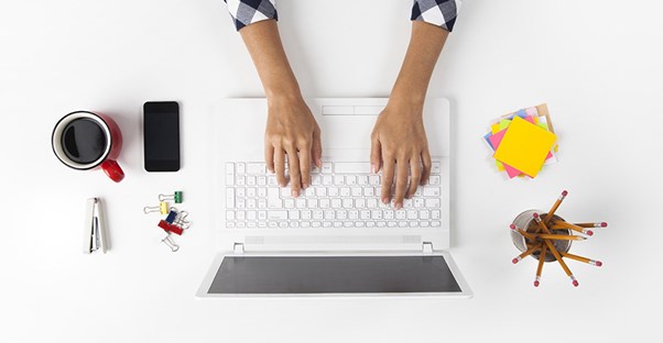Woman working on a laptop. Get more tech savvy.