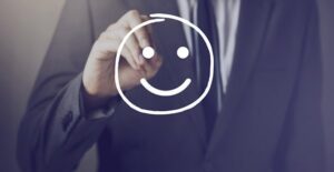 Smiley face on board. Employee recognition and engagement.