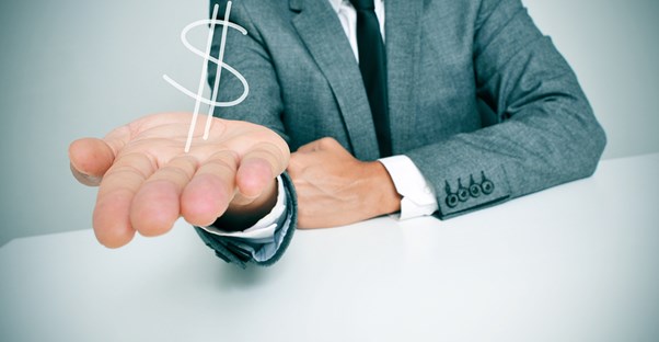 Man with an outstretched hand with a dollar sign