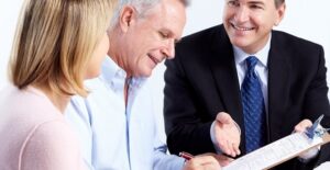 Couple working with a financial planner to plan for retirement