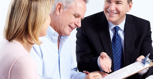 Couple working with a financial planner to plan for retirement