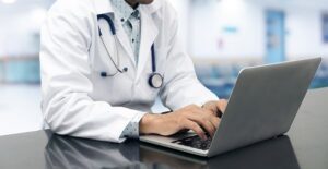 doctor at desk. irritable bowel syndrome vs colitis