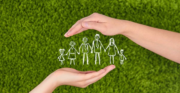 hands holding stick figure family. types of life insurance.