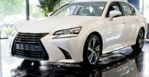 a white 2017 lexus gs in a dealership showroom