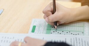 a student fills out an lsat test sheet