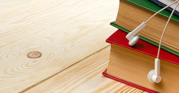 books and headphones on a desk symbolizing online law school