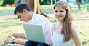 summer school versus summer internship. students working outside.