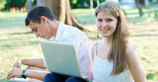 summer school versus summer internship. students working outside.