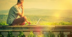 summer learning. man on laptop.