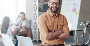a man in an office is excited to take leadership development training