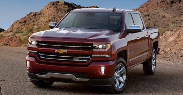 a red 2018 chevy silverado 1500 offroading