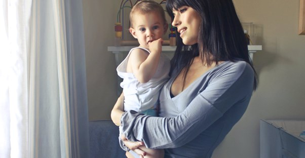 woman with baby at window
