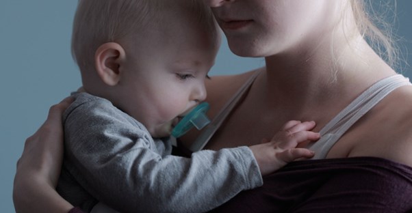 woman sad with baby