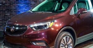 a maroon 2019 buick encore in a showroom