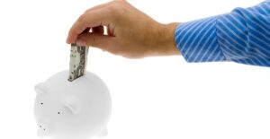 man saving money in a piggy bank