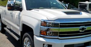 a white 2019 chevrolet silverado 2500hd in a parking lot