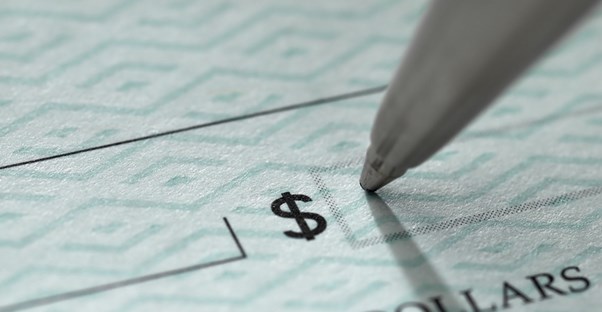 Pen writing a check