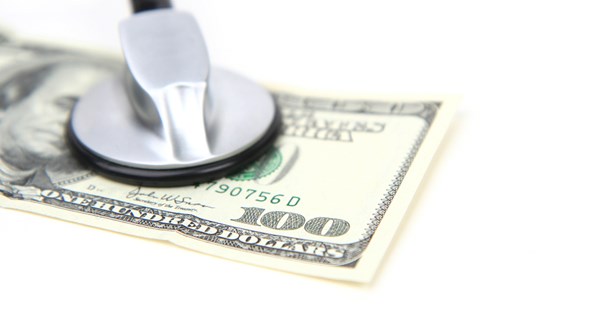 Stethoscope, presumably taking the heart beat of a hundred dollar bill