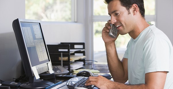 Man working from home and filing his taxes