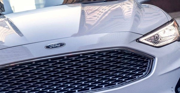 a 2019 ford fusion driving down the road