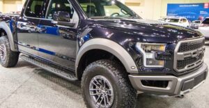 a black 2019 ford f150 in a showroom