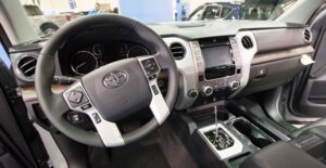 the steering wheel and dash interior of a 2019 toyota tundra