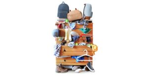 cluttered chest of drawers