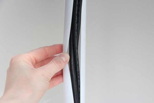 Hide cords in a shower rod cover.
