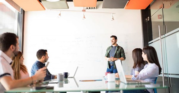 Man giving a presentation in an office conference room