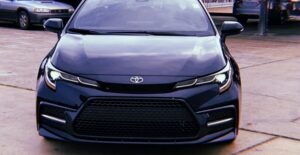 a black 2020 toyota corolla in a parking lot