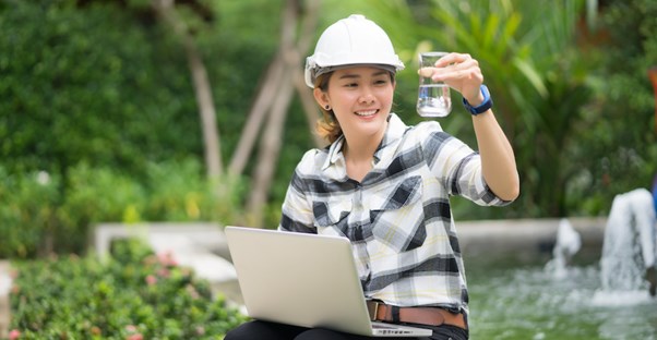 Woman getting her environmental engineering degree conducting research.