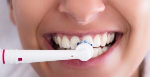 woman brushing her teeth