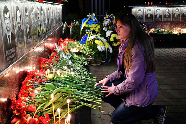 A Woman Pays Her Respects to the Chernobyl Victims in Slavutych