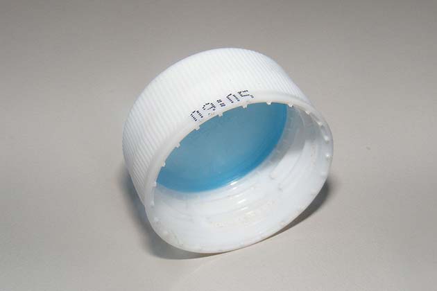 The Plastic Disc Under Bottle Caps