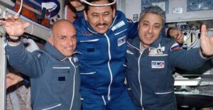 Dennis Tito, the first space tourist, and two astronauts.