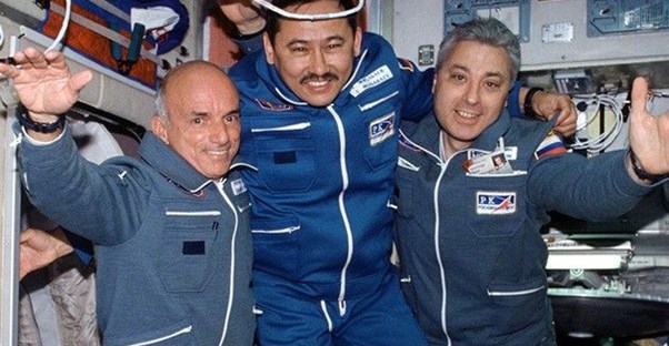 Dennis Tito, the first space tourist, and two astronauts.