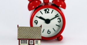 Alarm clock behind a tiny house