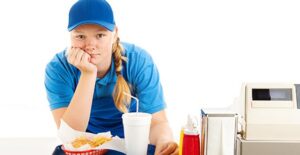 girl bored at fast food restaurant