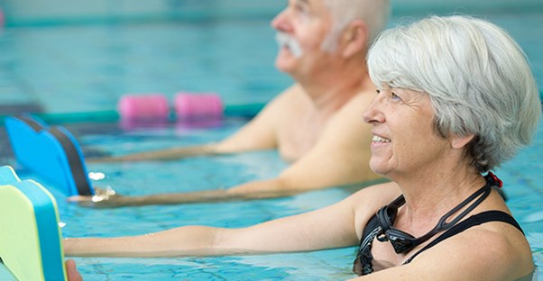 people exercising in swimming pool
