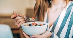 woman eating cereal