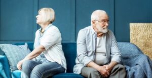 Older couple sitting on the couch together