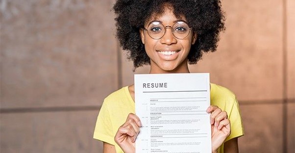 woman holding up resume